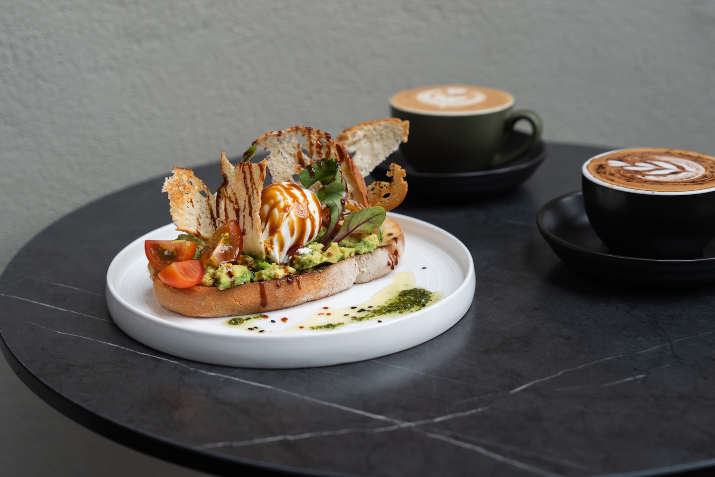 Smashed avo with coffee on table